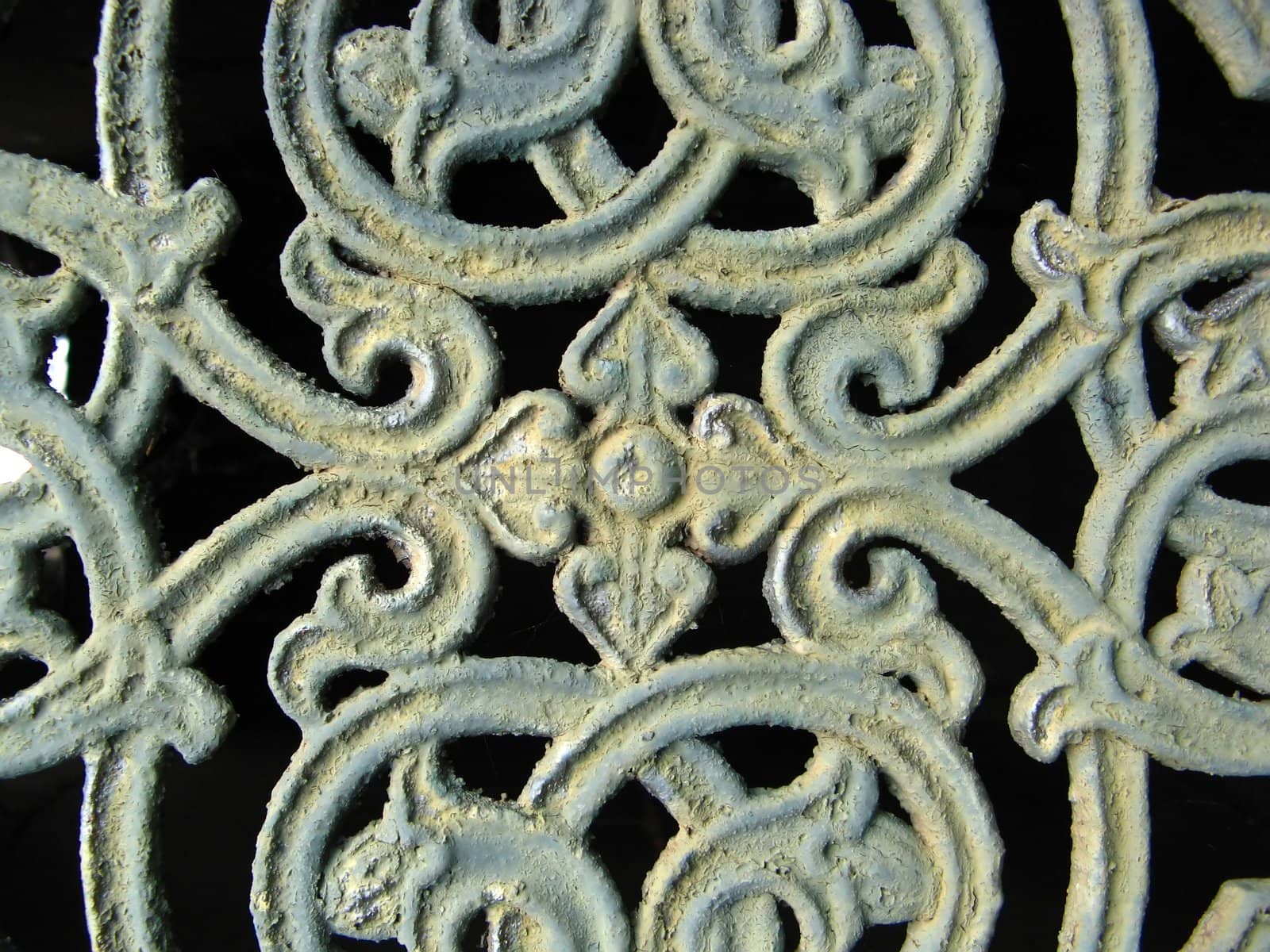 close-up of a grave door ornament in Pere Lachaise parisian cemetery