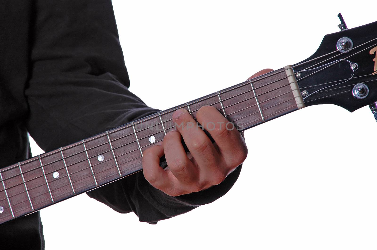 Close-up view of guitar and musician's hands
