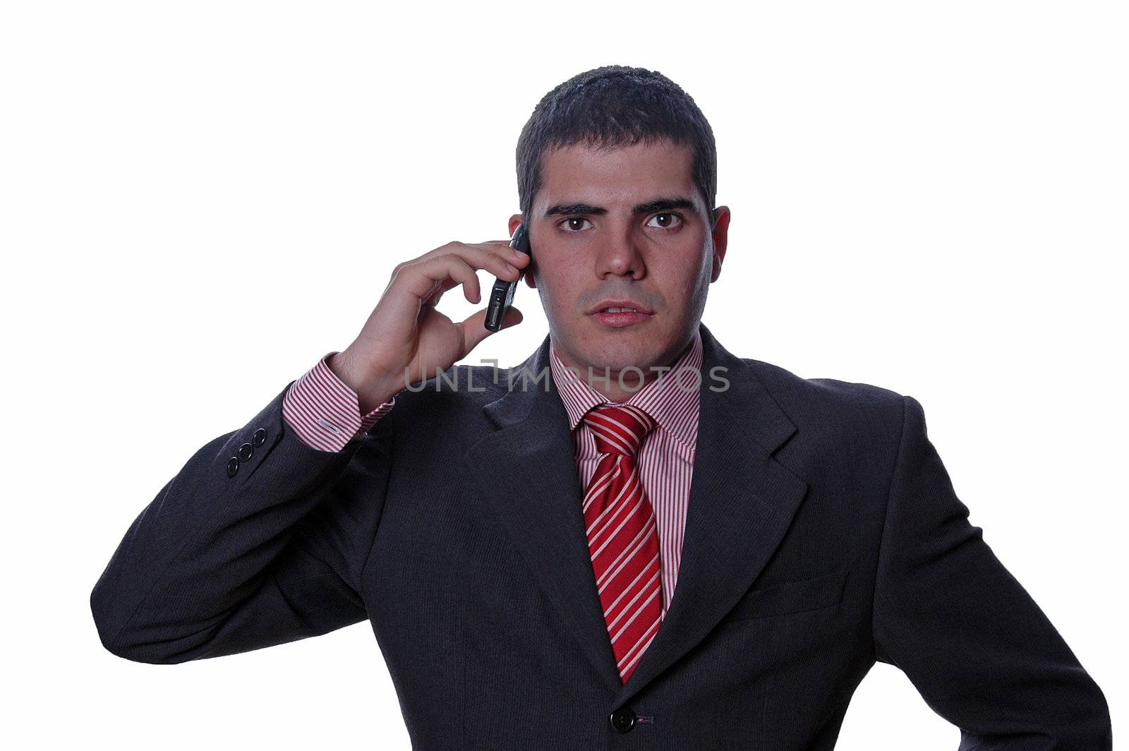 young businessman talking to mobile phone over white background