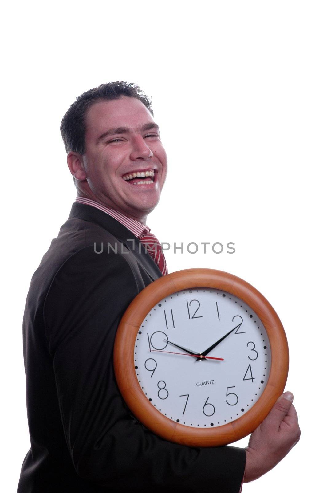 young and happy businessman hplding wall clock