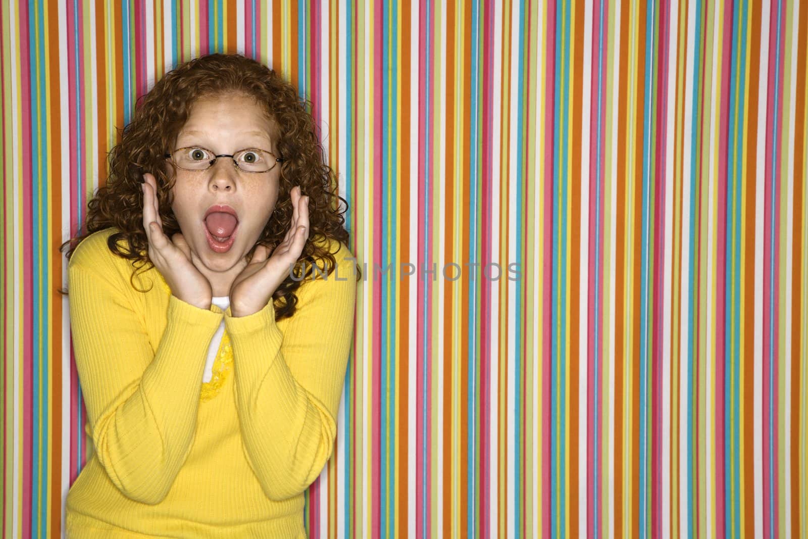 Caucasian female child looking surprised.