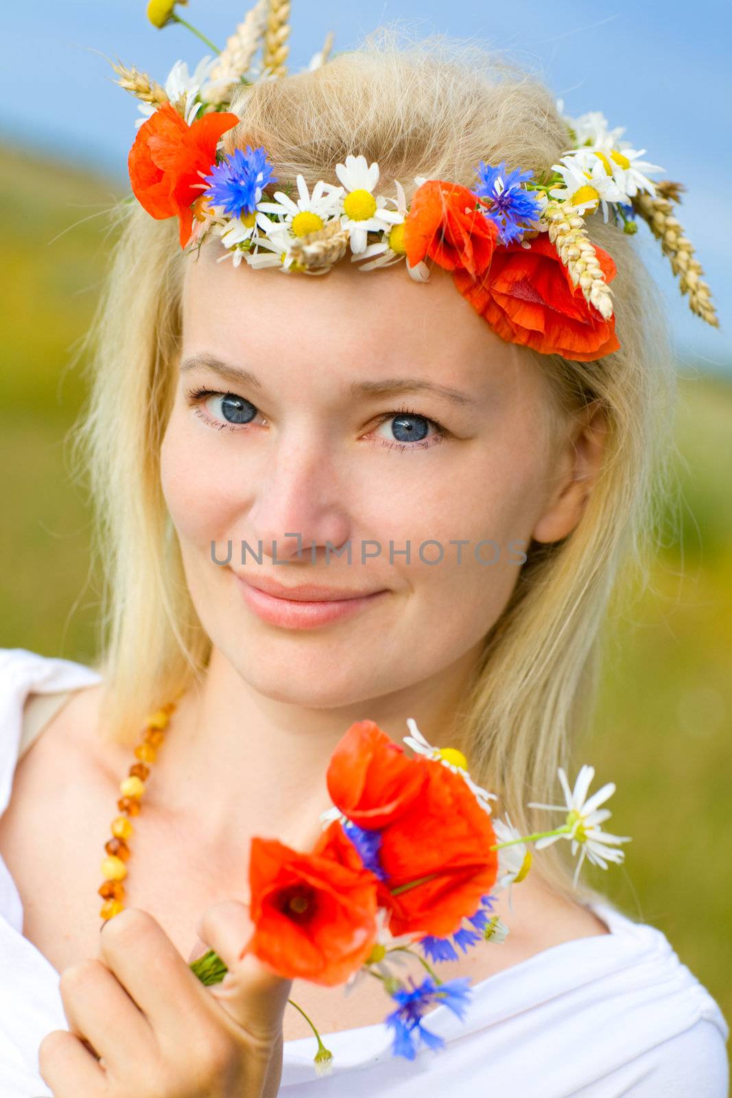 woman in the field with poppies by vsurkov