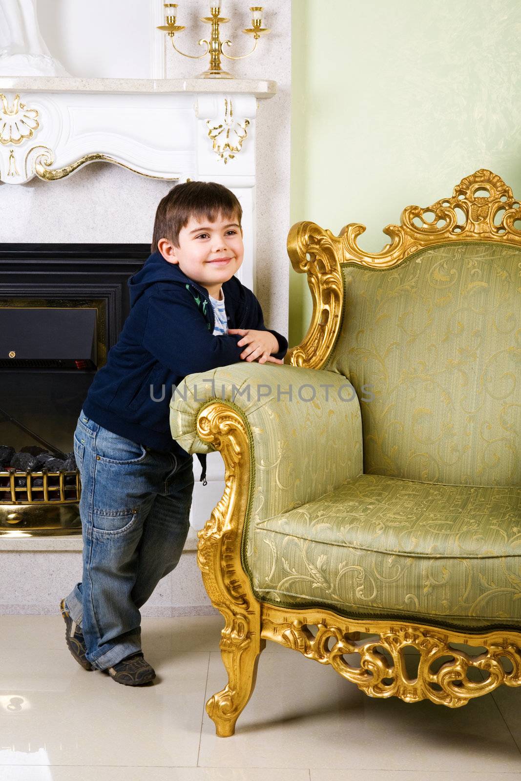 boy near the old armchair