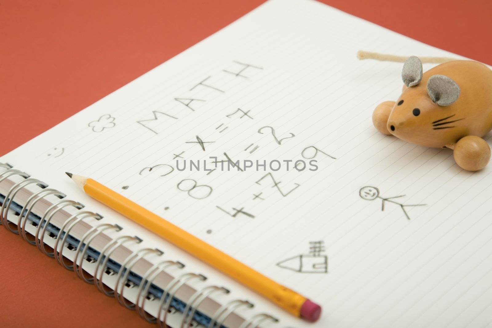 math homework with pencil and wooden toy