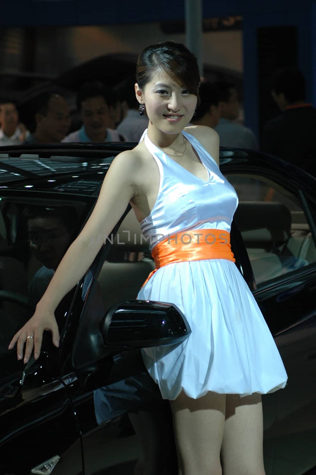 Chinese model. Girls promoting modern cars during Shenzhen Moto - car show in China.