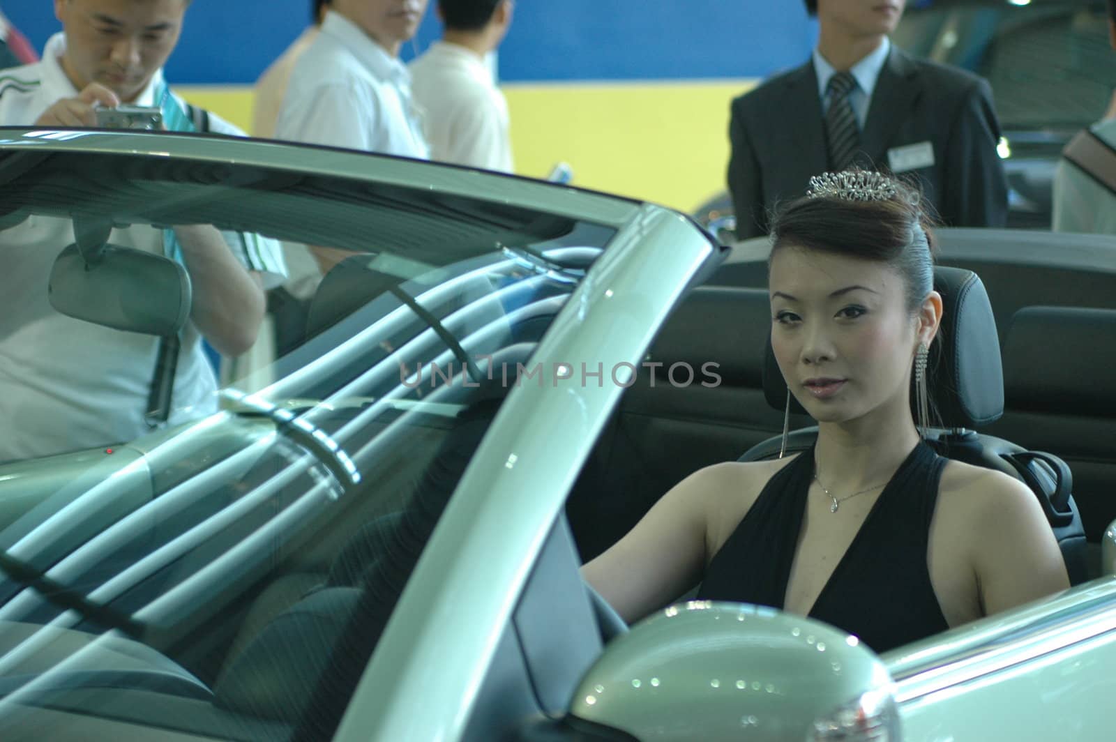 Chinese model. Girls promoting modern cars during Shenzhen Moto - car show in China.