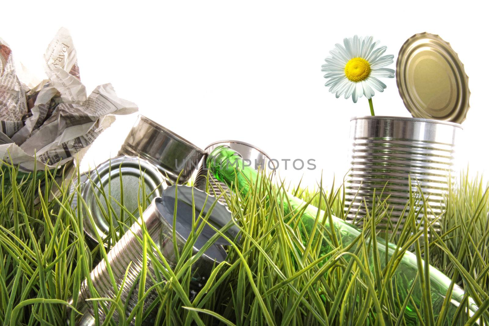Trash, empty cans and bottles in the grass