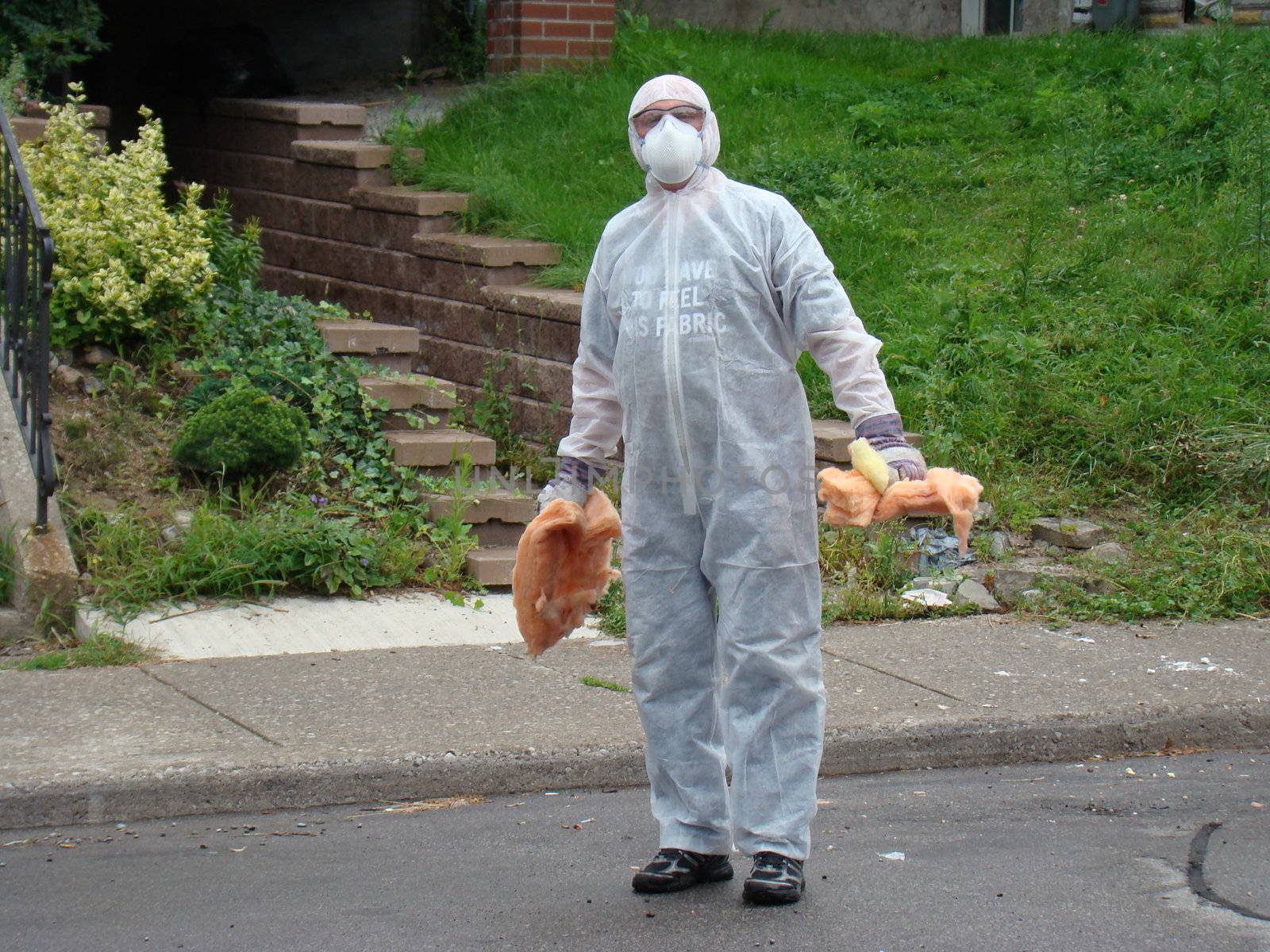 hazzardous waste removal by man wearing protective gear