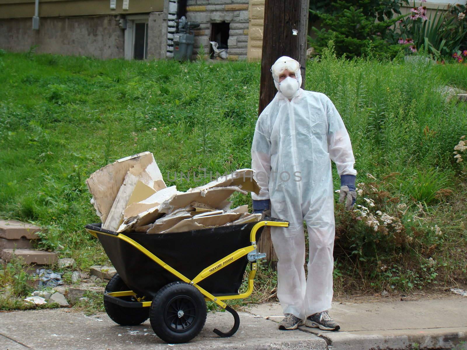 hazzardous waste removal by man wearing protective gear