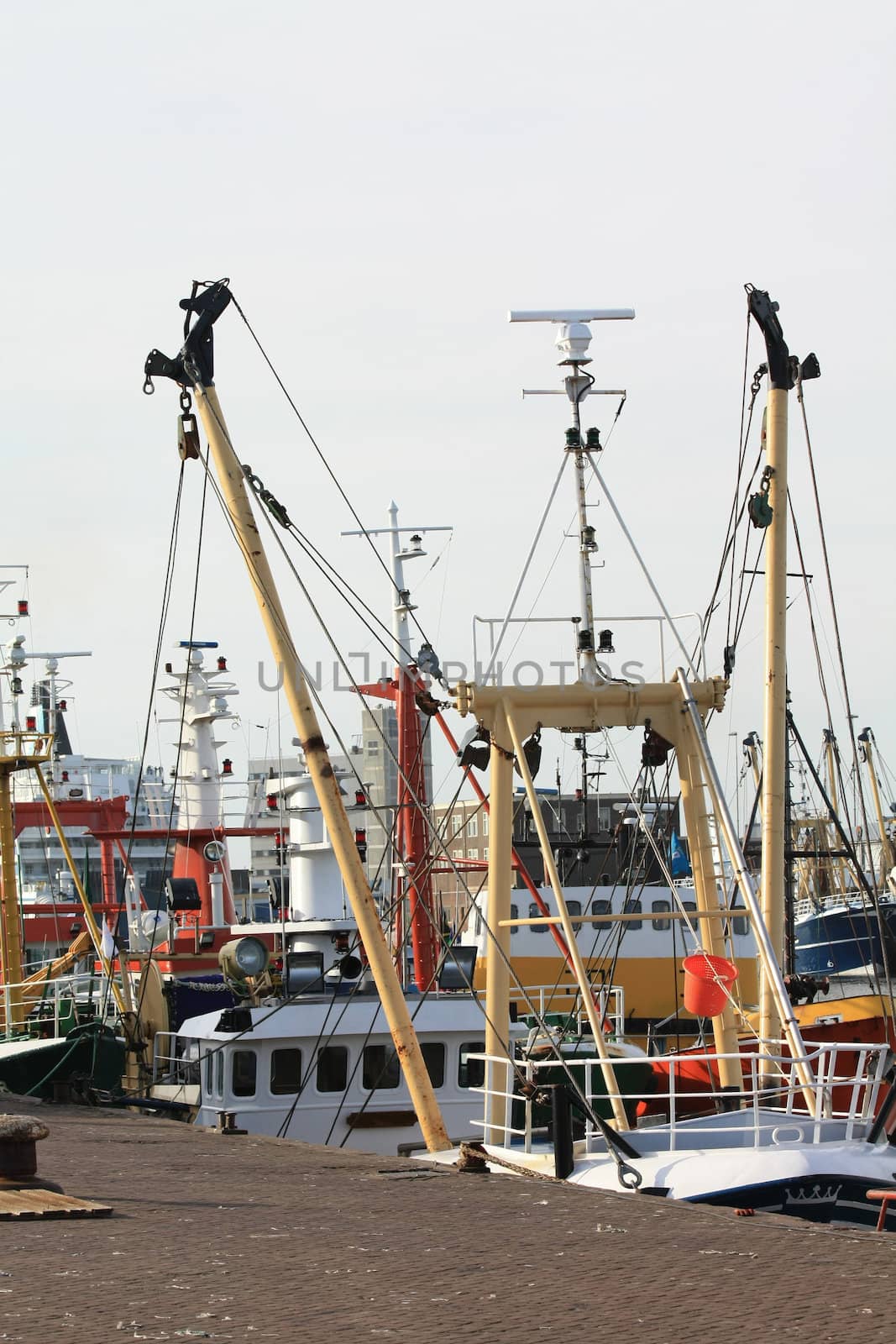 Fisher trawlers in harbor by studioportosabbia