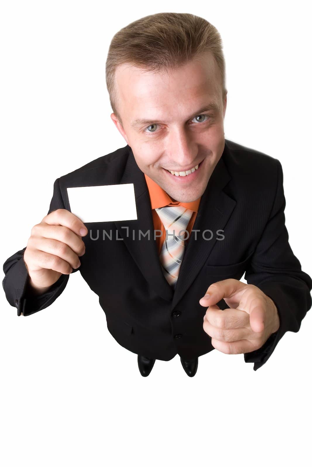 Young businessman holds an empty business card, isolated on white background.