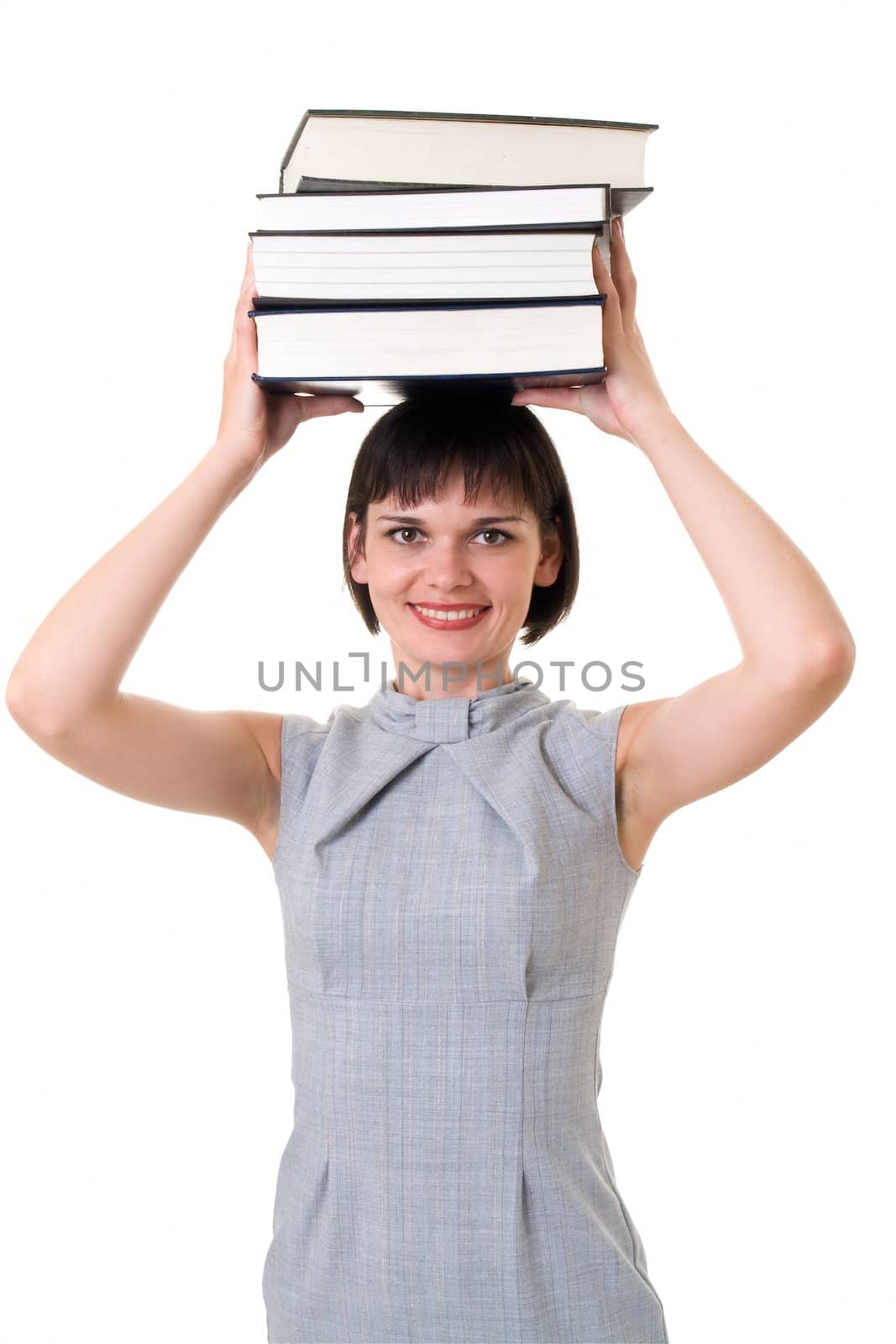 Charming student on a white background. Thick books on the head. 