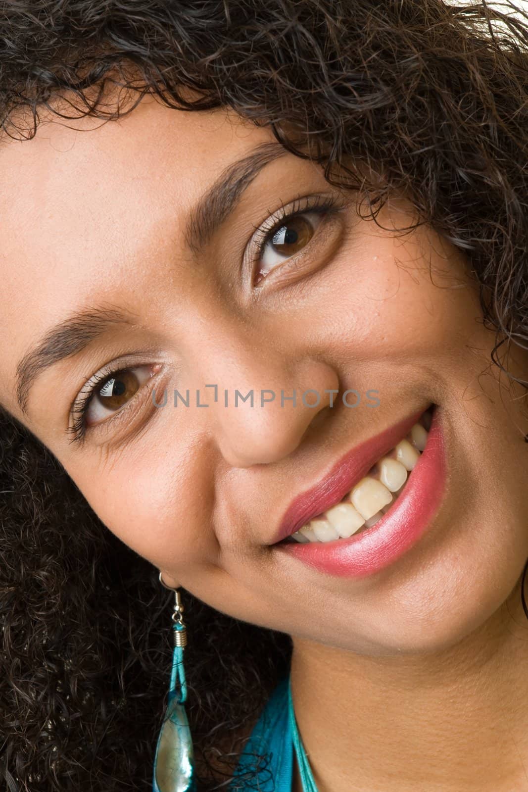 The beautiful smiling black woman close up.