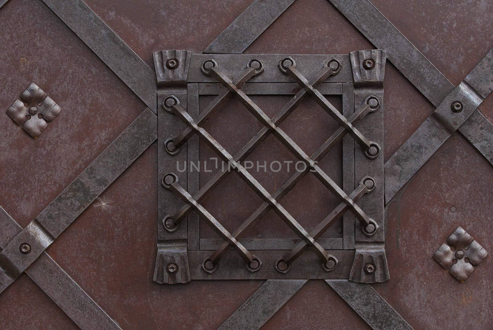 Metal lattice of a skylight on a medieval gate. A close up.