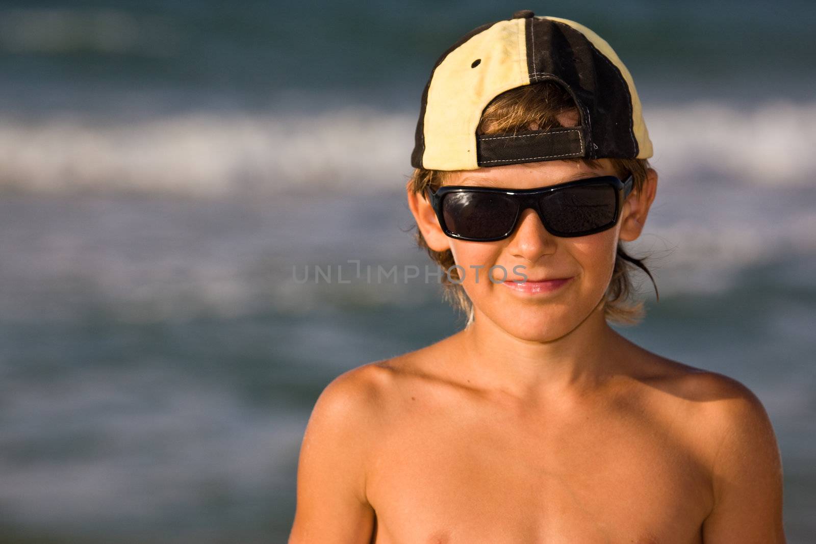 people series: portarit of boy on summer sea beach