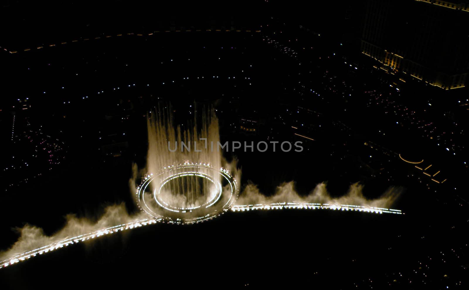 high above some fountains at night