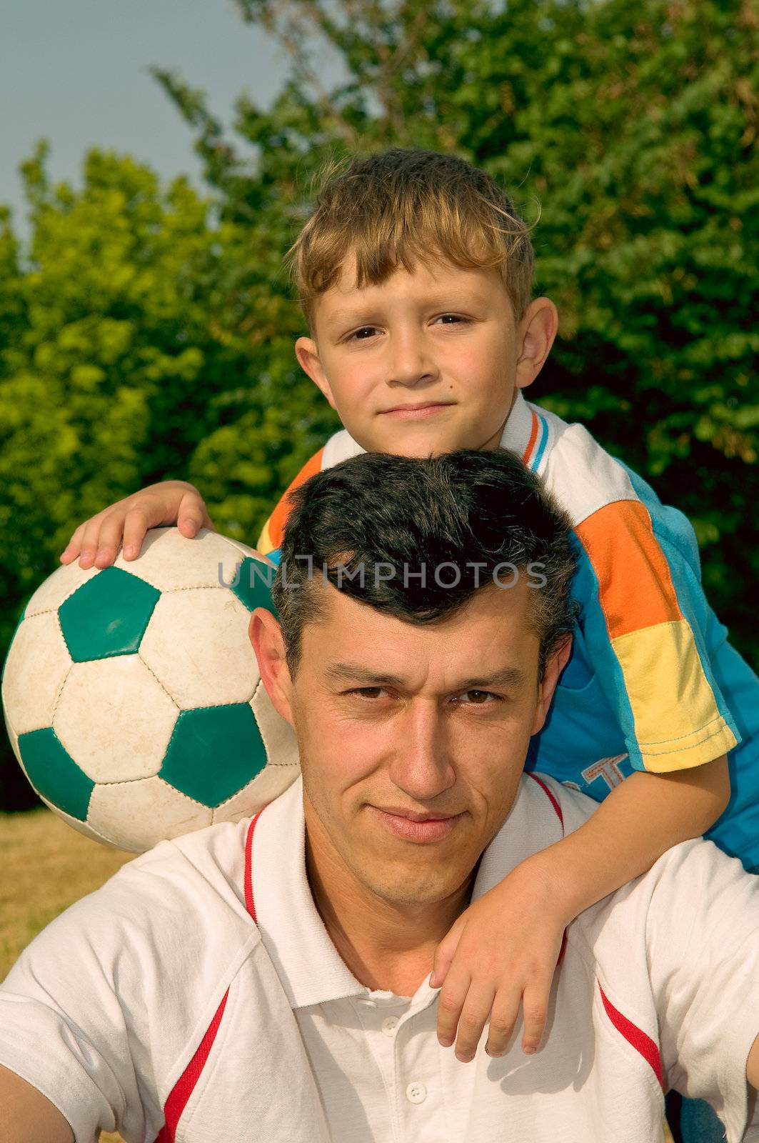  The son with the father on football of a local command(team)