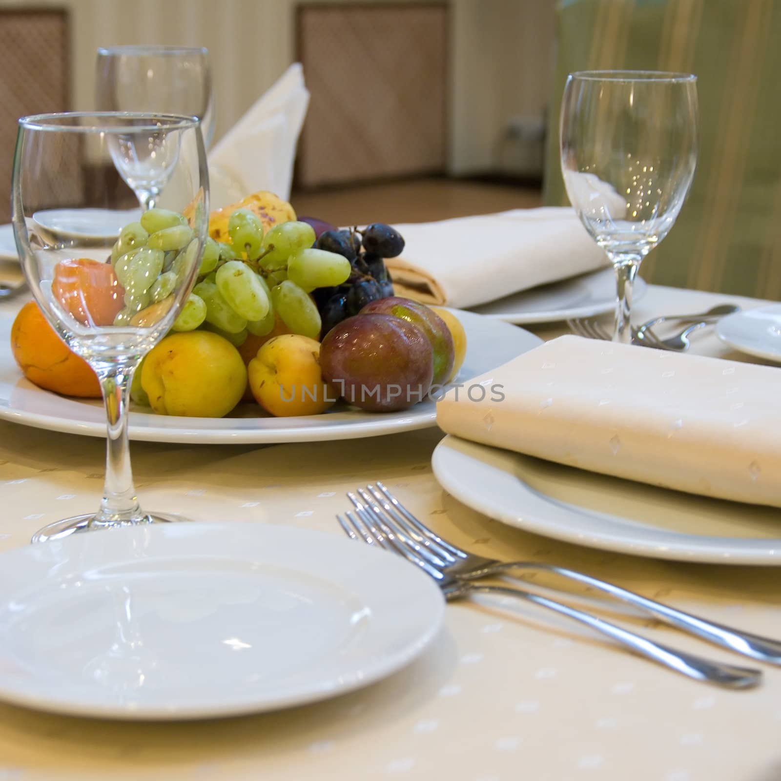 Table with fruits prepared for dinner in restaurant