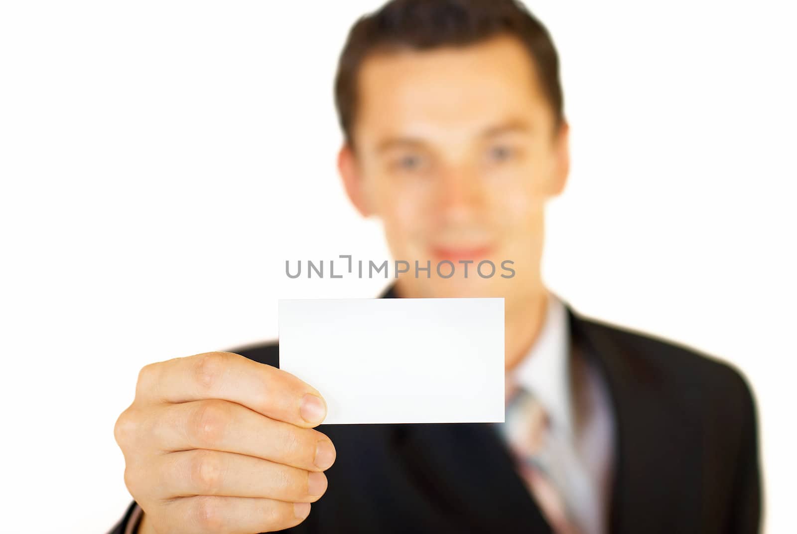 Young businessman holding blank card by DmitryYakunin