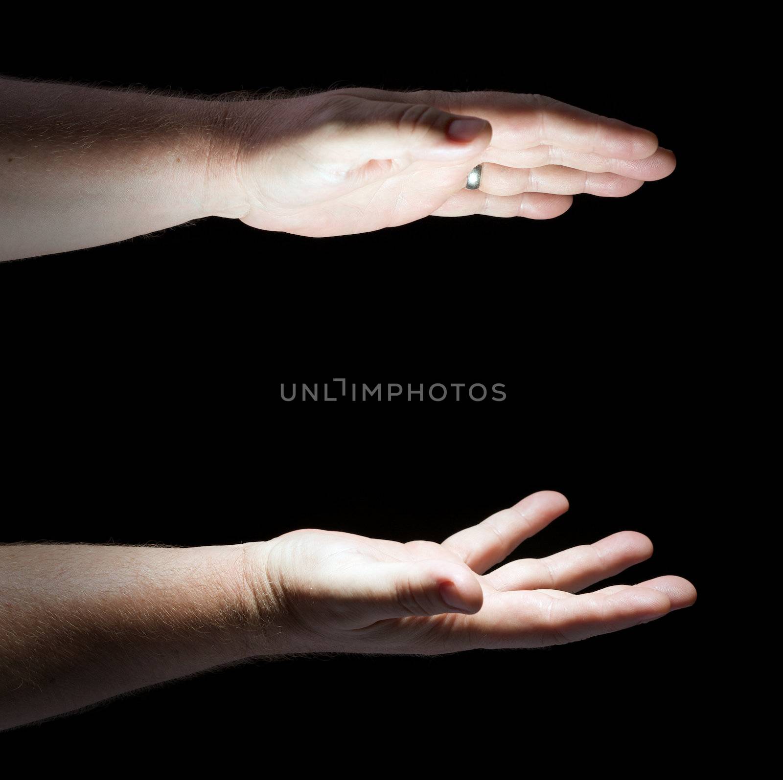 Glowing Hands on Black Background Ready for Your Product.