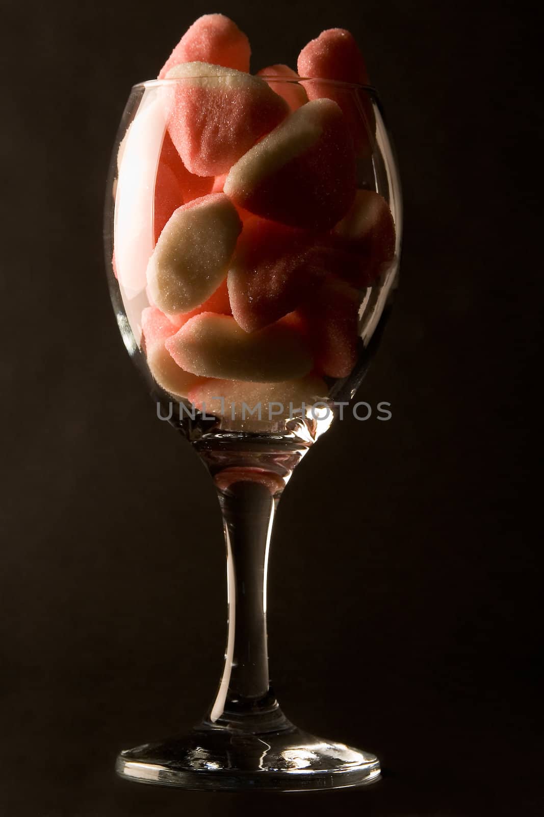 Pink candies in a glass.