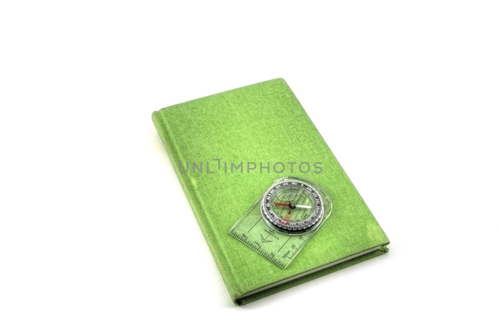 A green travel journal isolated on white.