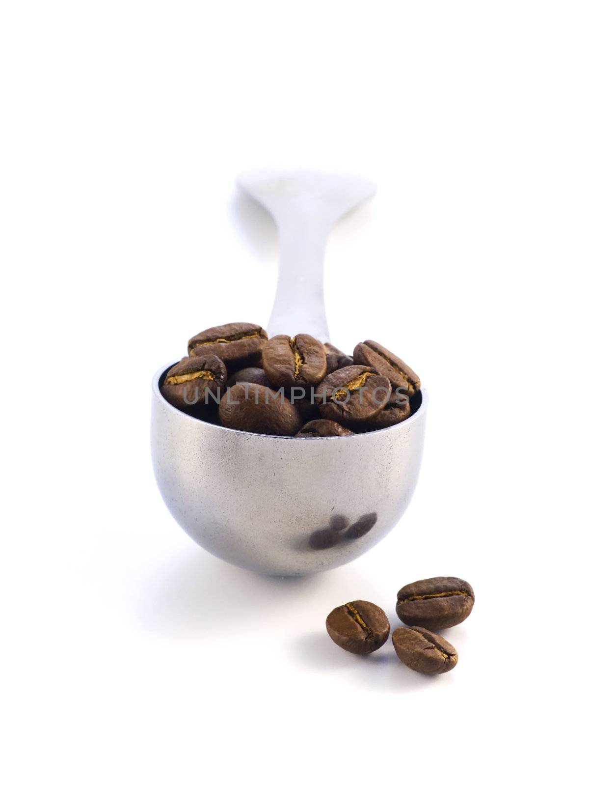 spoon full of coffee beans isolated on white background