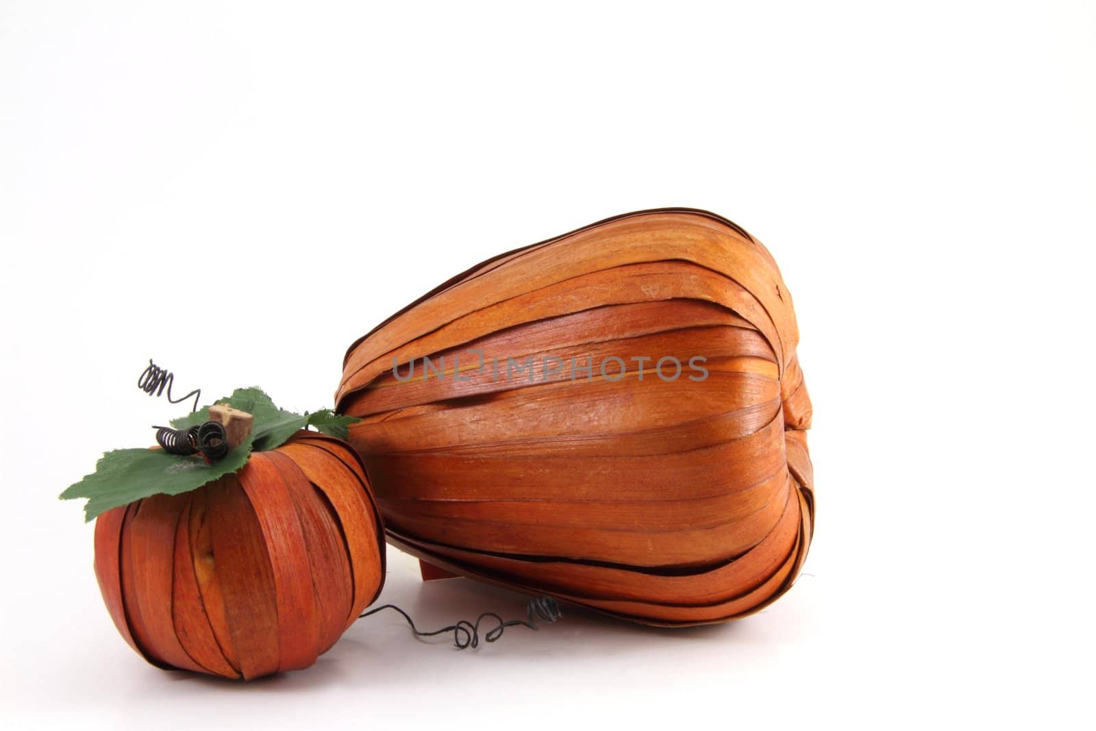 Artistic pumpkin fashioned from natural materials and isolated with copy space.
