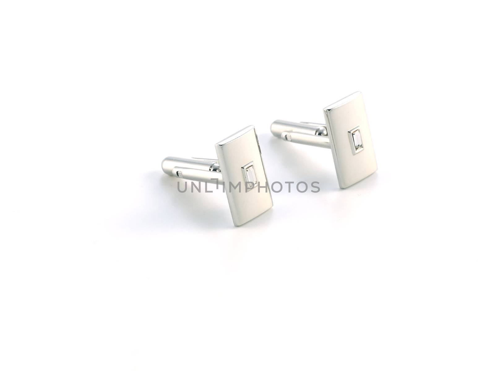 silver cuff link isolated on white background