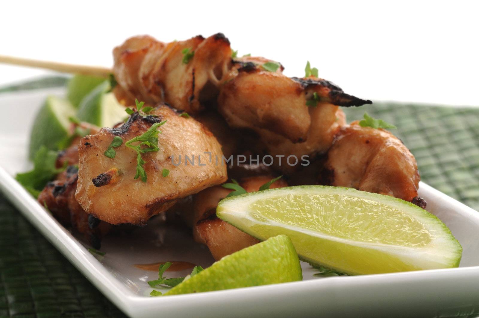 Tasty grilled chicken satay with fresh lime.