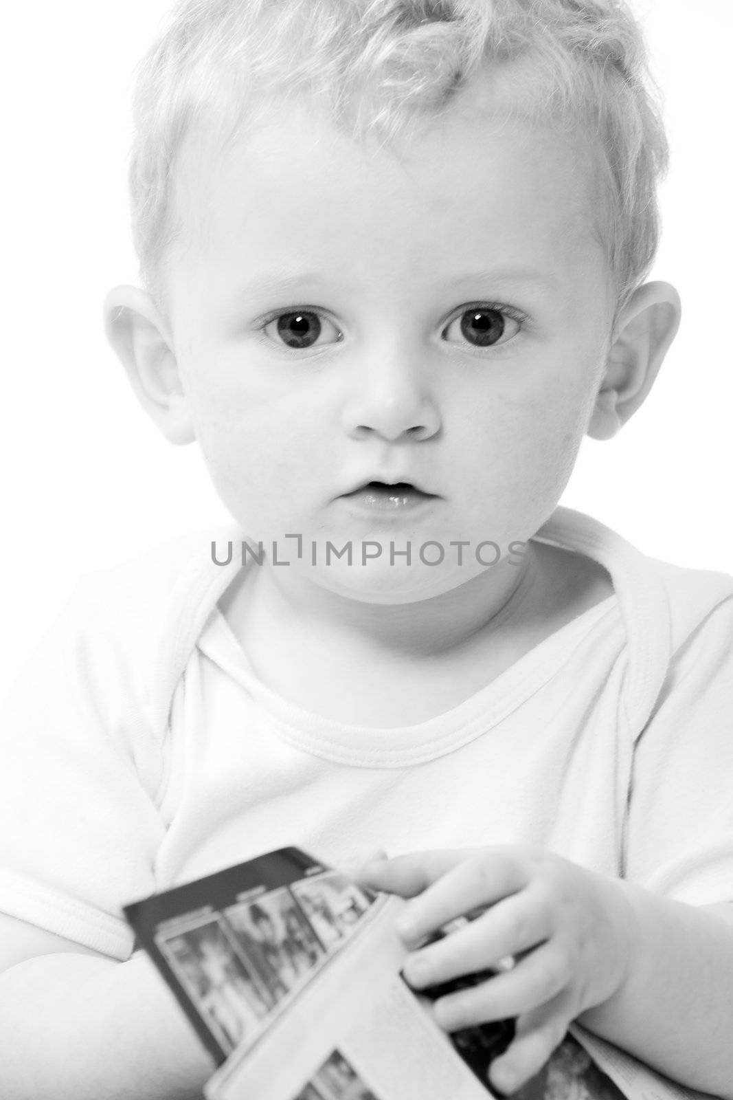 Cute caucasian blond toddler ishappy and playfull