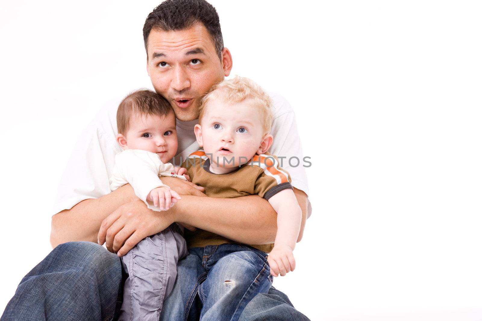 Cute brother and sister from different races having fun with daddy