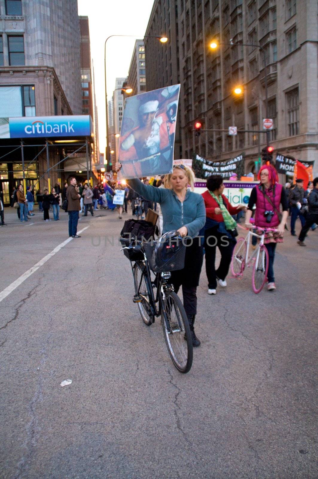 CHICAGO, IL-MAR. 18, 2010: Protesters march through downtown Chicago, demonstrating against US military involvement in Iraq and Afghanistan on March 18, 2010.