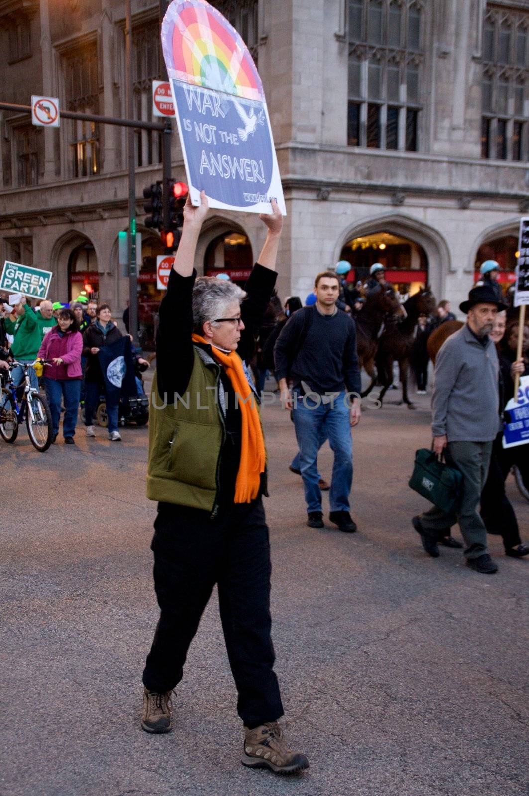 CHICAGO, IL-MAR. 18, 2010: Protesters march through downtown Chicago, demonstrating against US military involvement in Iraq and Afghanistan on March 18, 2010.