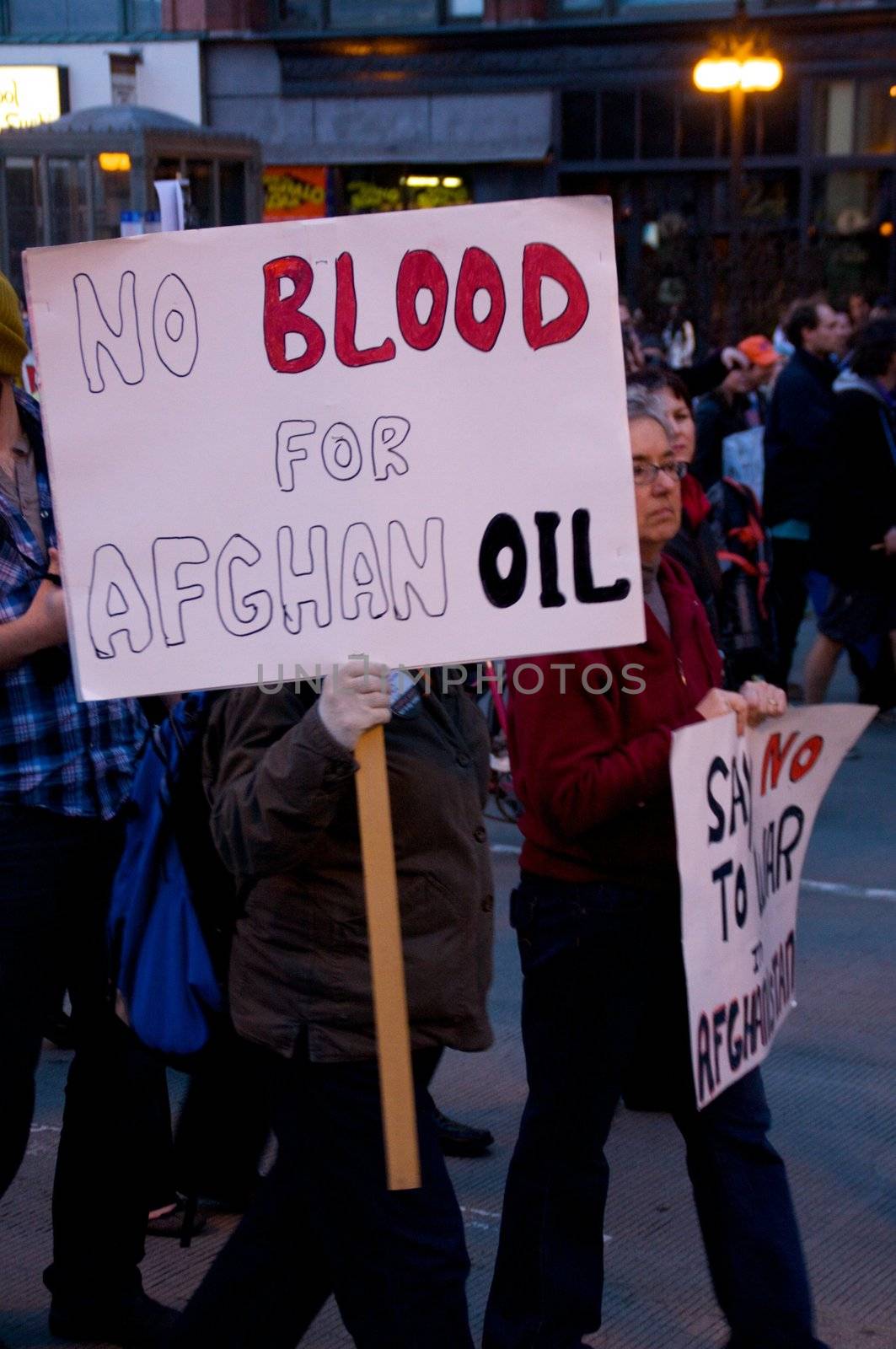 CHICAGO, IL-MAR. 18, 2010: Protesters march through downtown Chicago, demonstrating against US military involvement in Iraq and Afghanistan on March 18, 2010.