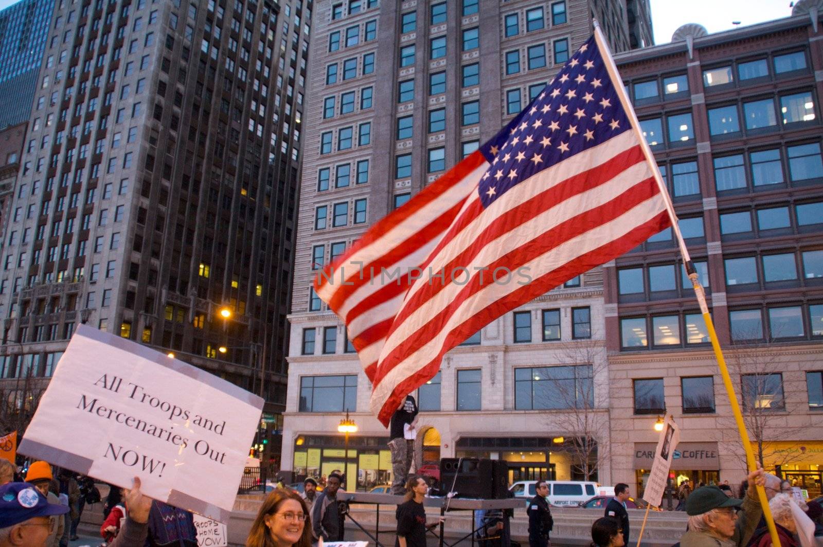 CHICAGO, IL-MAR. 18, 2010: Protesters march through downtown Chicago, demonstrating against US military involvement in Iraq and Afghanistan on March 18, 2010.