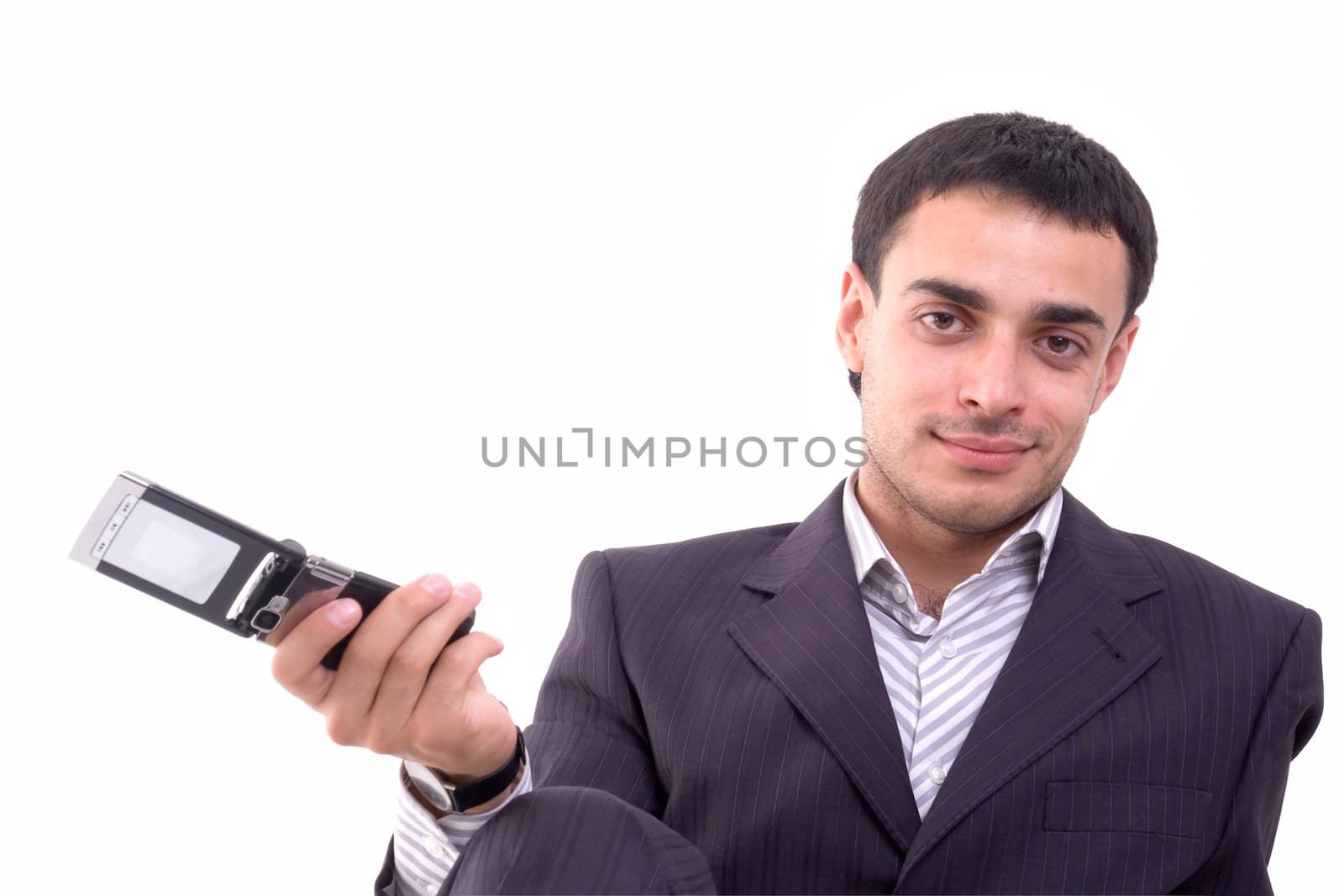 Young man with mobile phone on a white background.