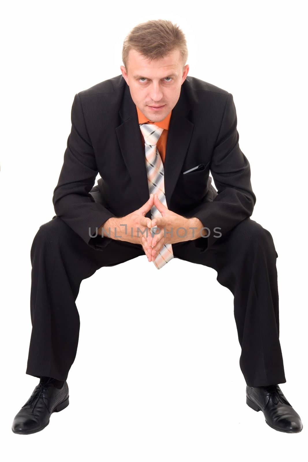 sad businessman sits on a white background
