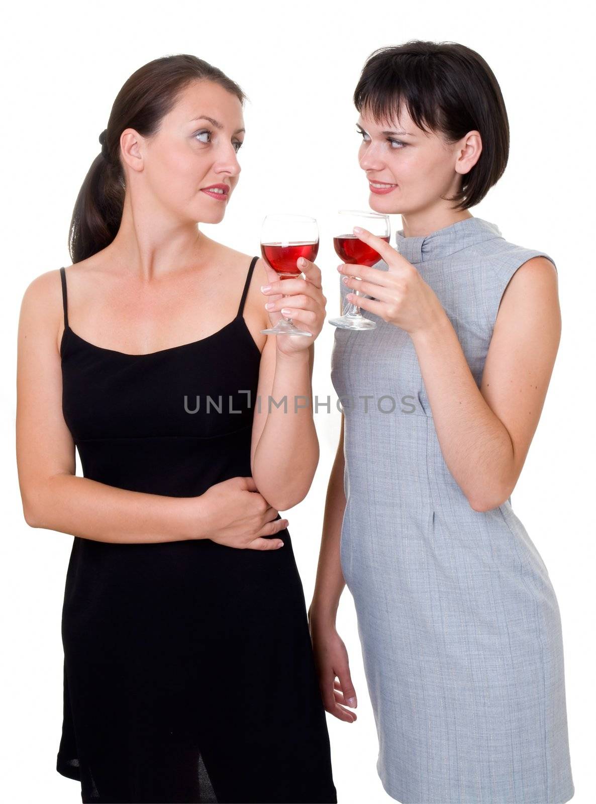 Party. Two beautiful girls with wine, isolated on white. 