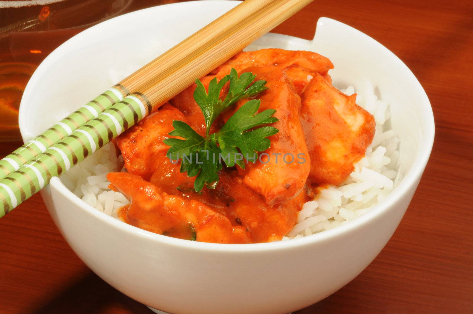 Delicious butter chicken served on white rice.