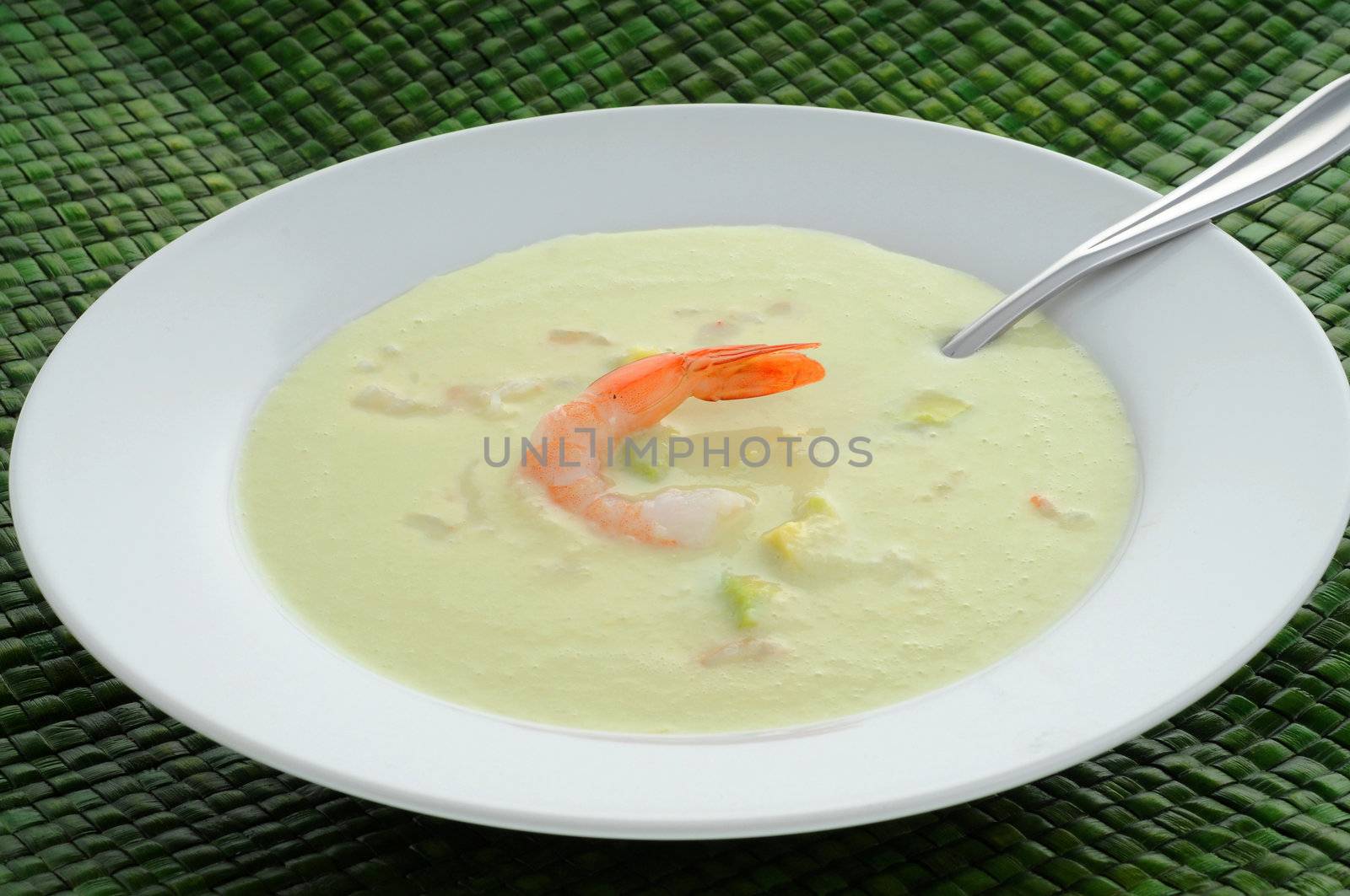 Refreshing cold avocado, cucumber and shrimp soup.