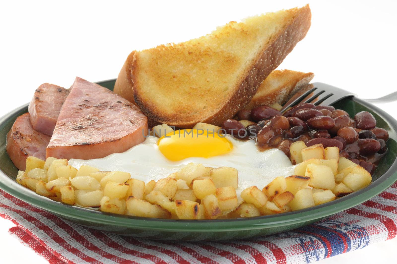 Delicious ham and egg breakfast with toast and beans.