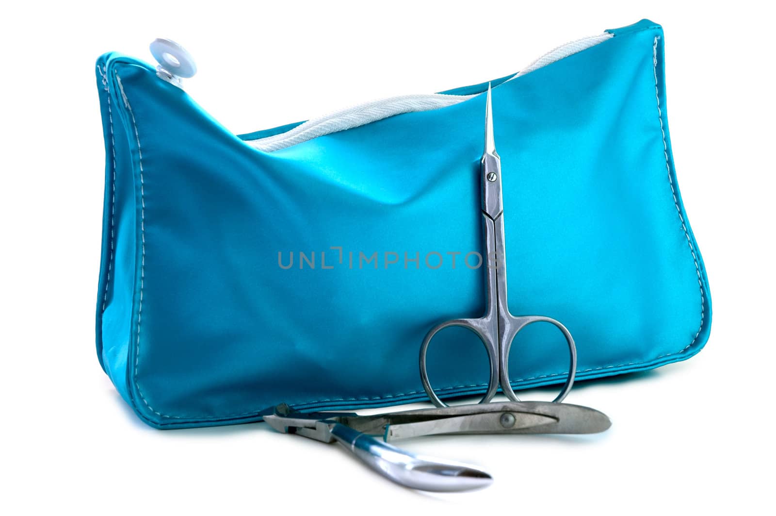 Blue beautician and nail scissors - manicure set on isolated background.