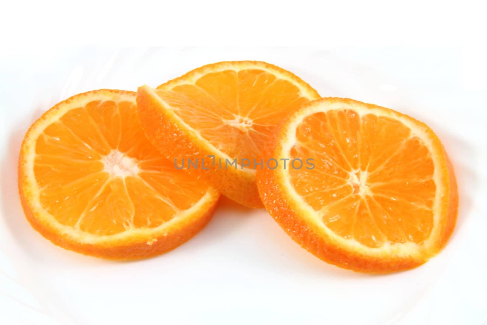 Fresh orange slices isolated on white.
