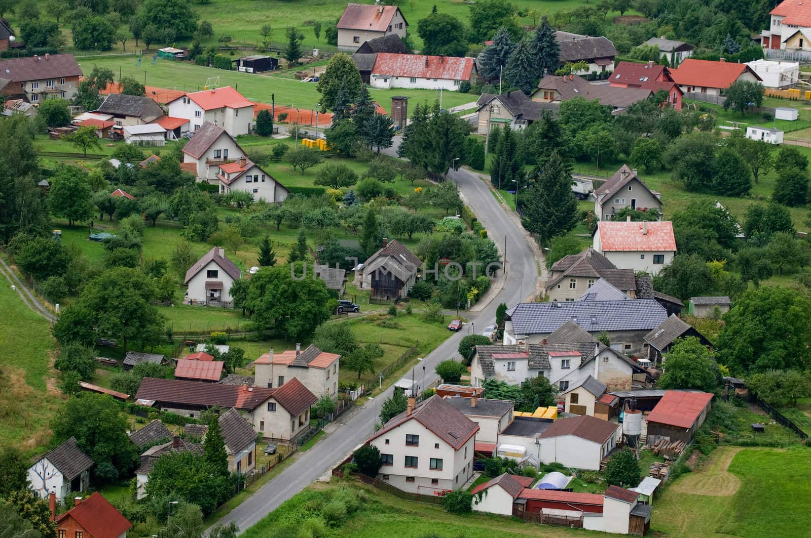 View on the small village located on hills. From height of the bird's flight