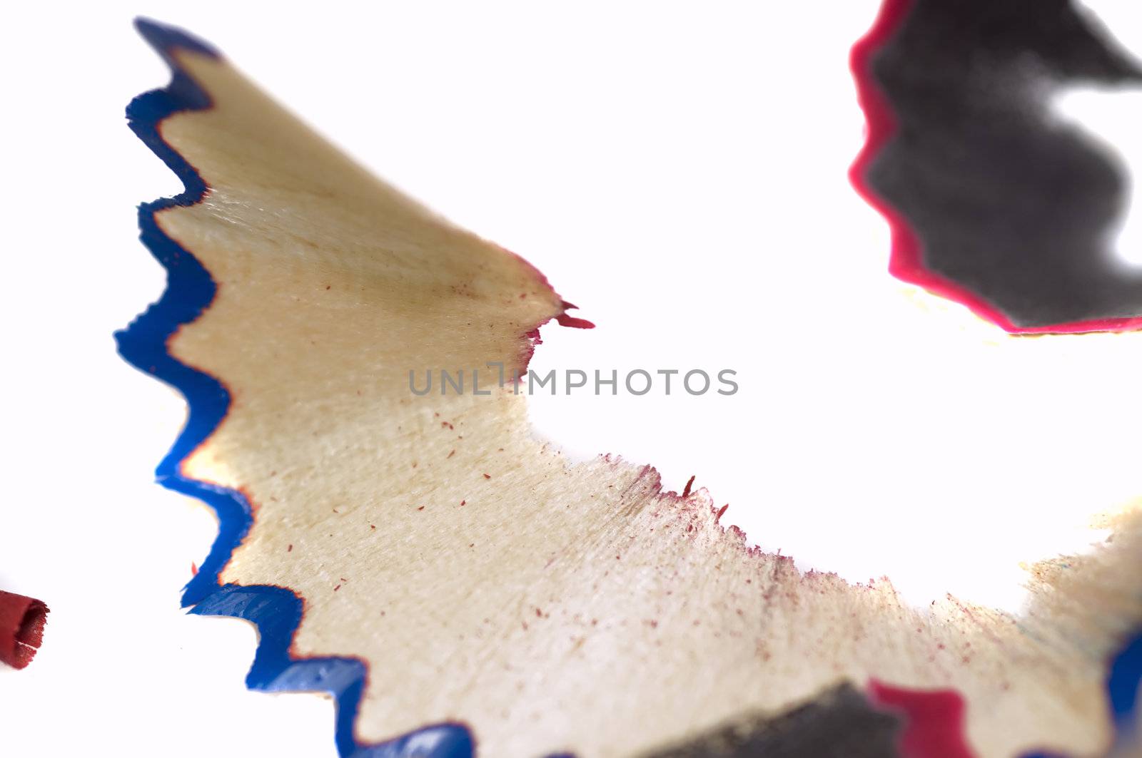 red and blue wood shavings on light color wood background