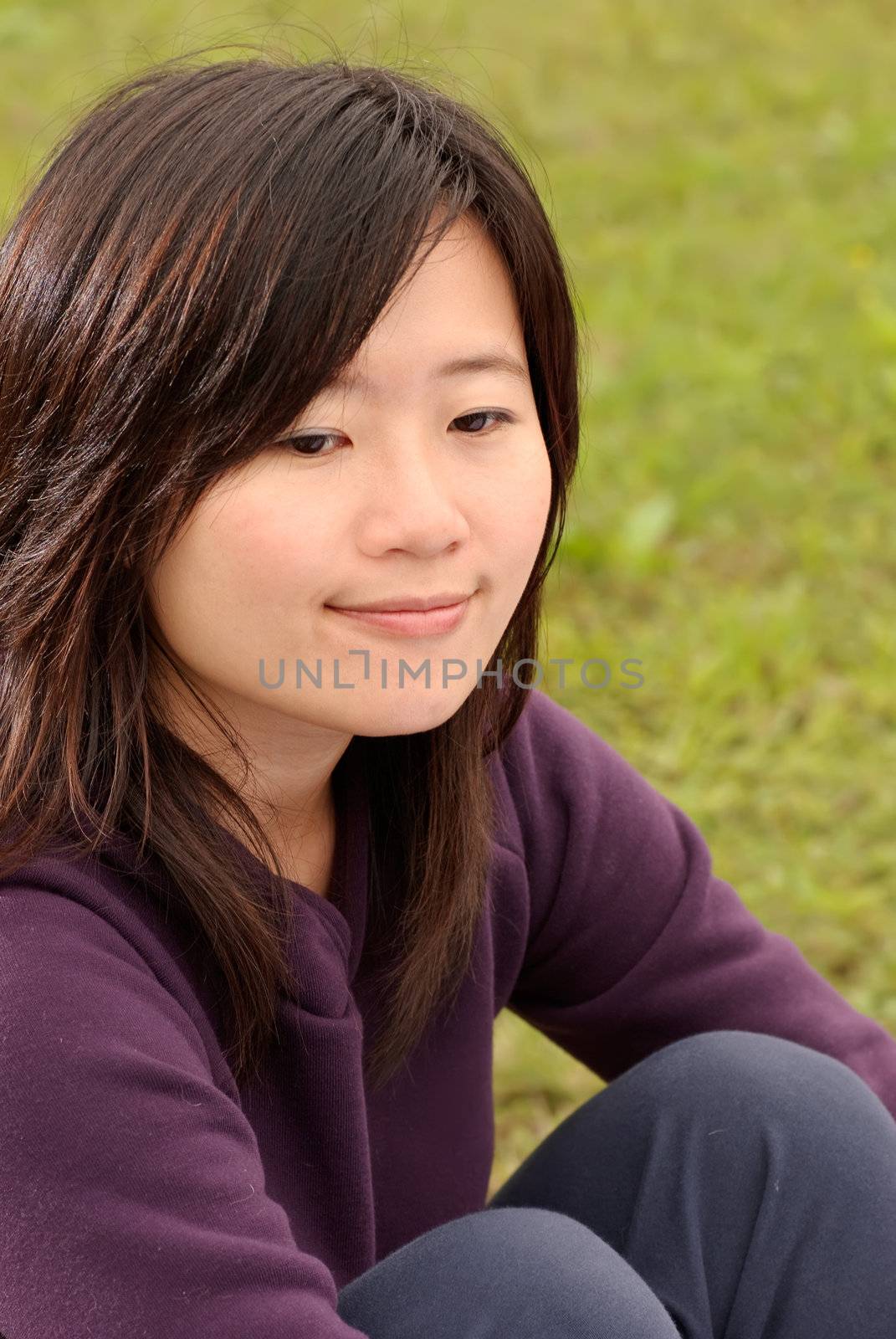 Smiling Asian beauty portrait in outdoor of park.