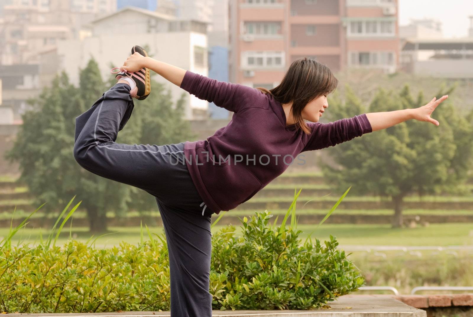 Yoga excise of Asian woman in outdoor of park in city.