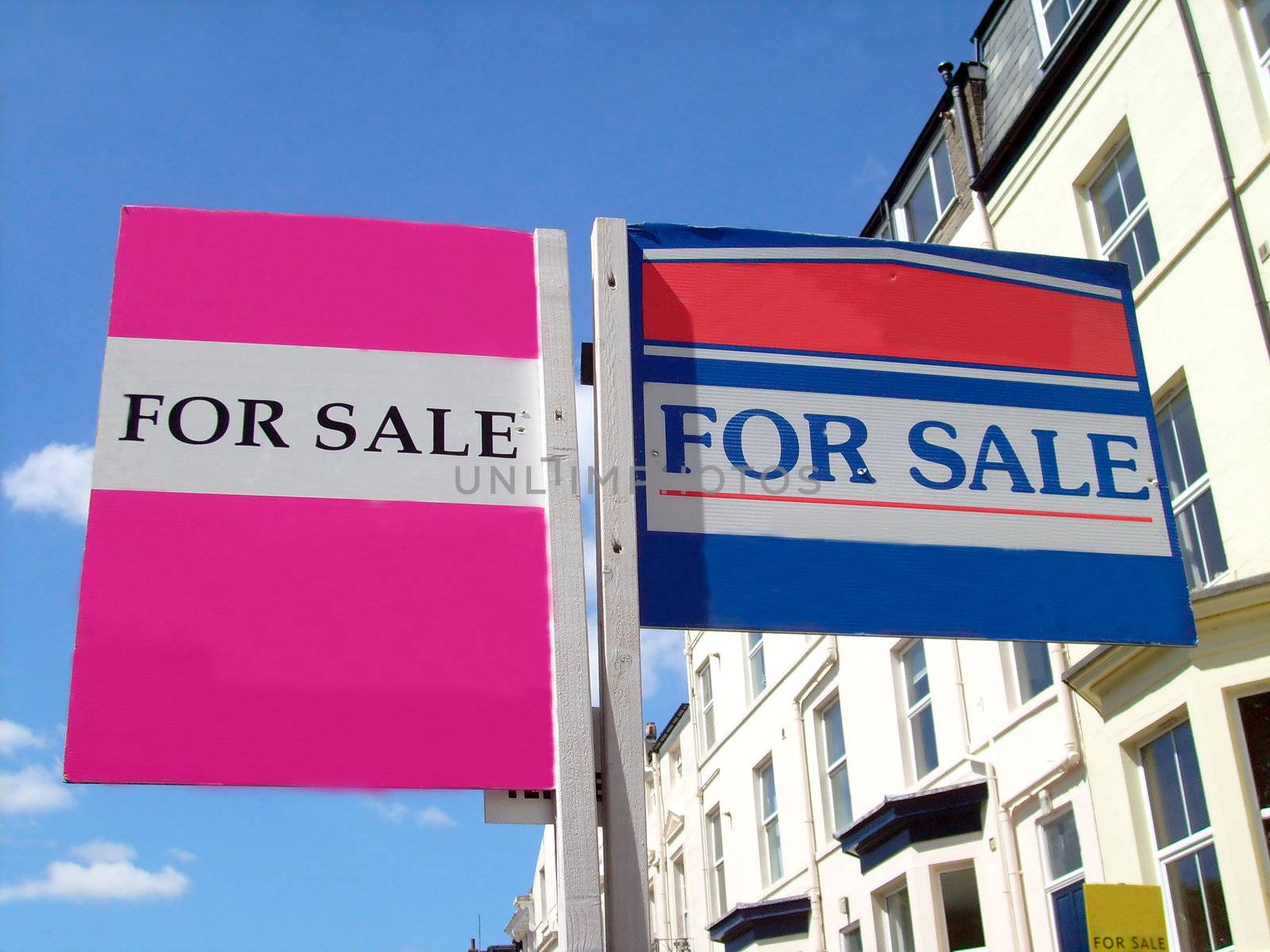 Two for sale sign in English street, with space for company names.