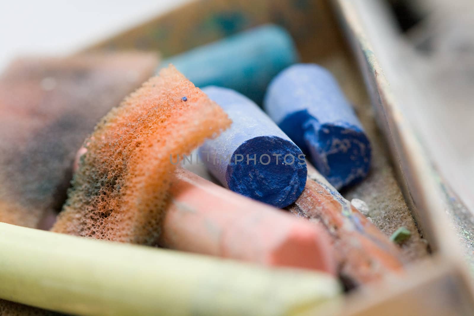 pastel crayon and other art tools on neutral background macro